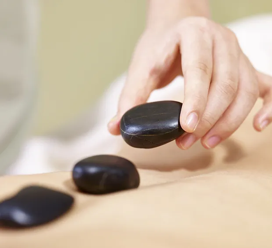 a person receiving a hot stone massage  at a Nakhon Thai Massage in Parnell, Auckland