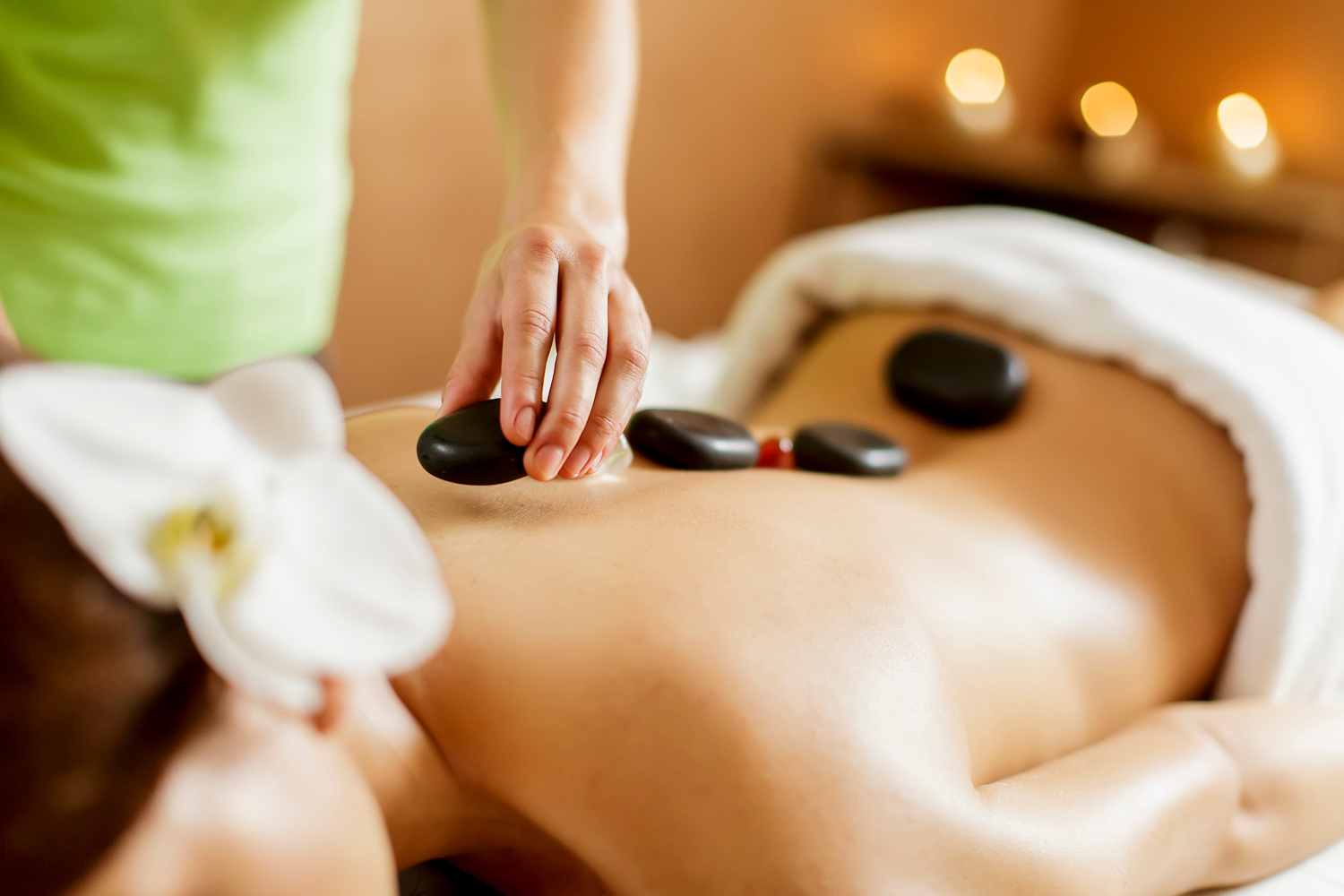 a person getting a hot stone massage at Nakhon Thai Massage in Parnell Auckland, the Best Thai Massage in Auckland